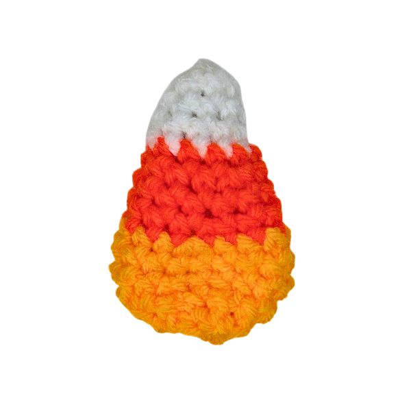 A crochet candy corn fidget toy with a snap clip barrette inside against a white background.